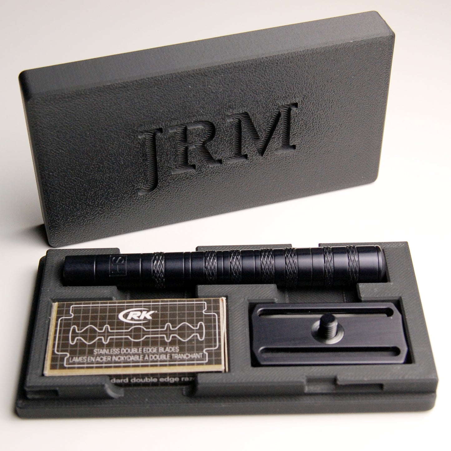 Black Henson Razor case with JRM personalization on a white background.