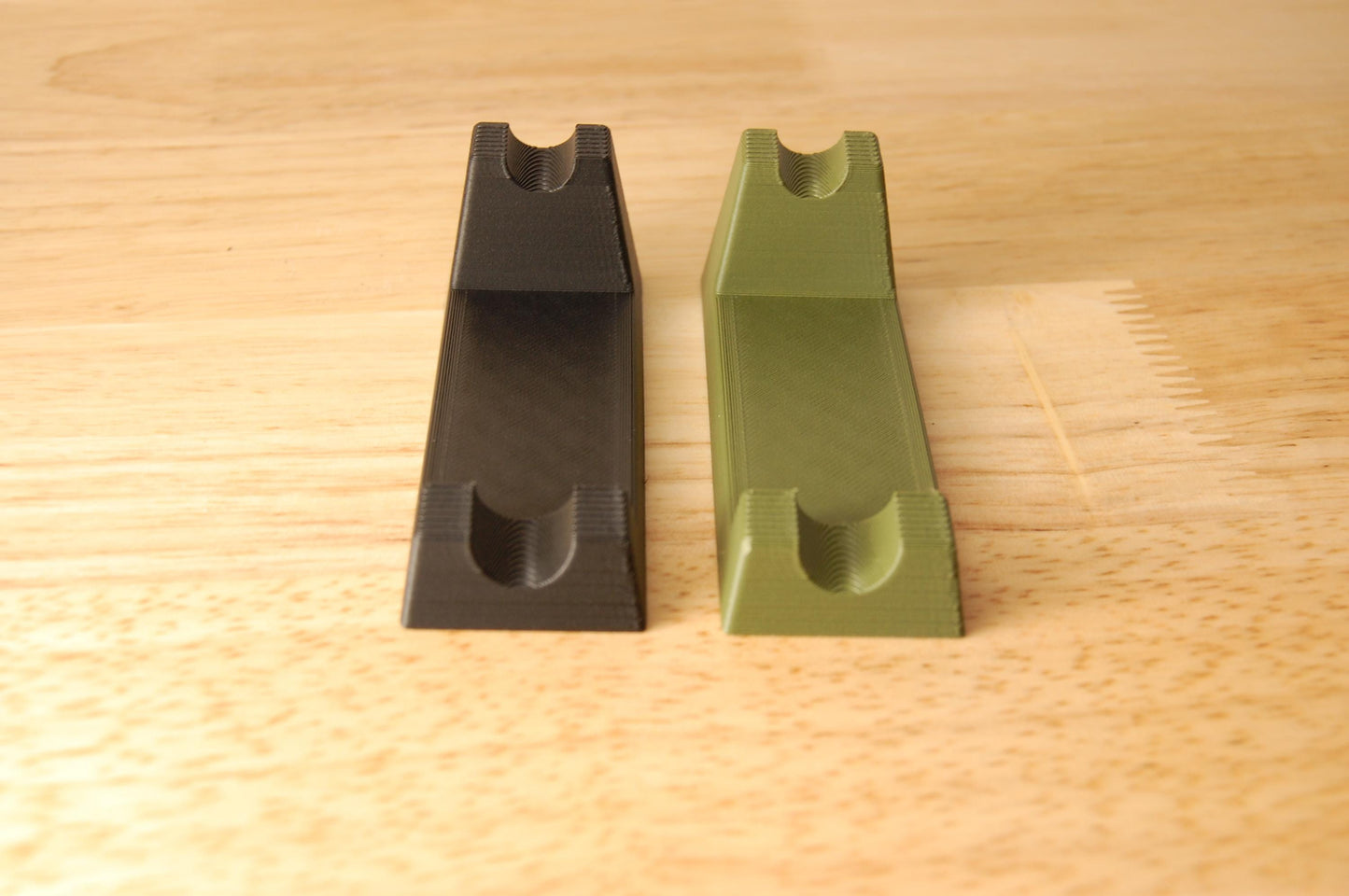 Henson Safety Razor Stands in Olive and Black, safety razor. The stand is on a wooden butcher block table.