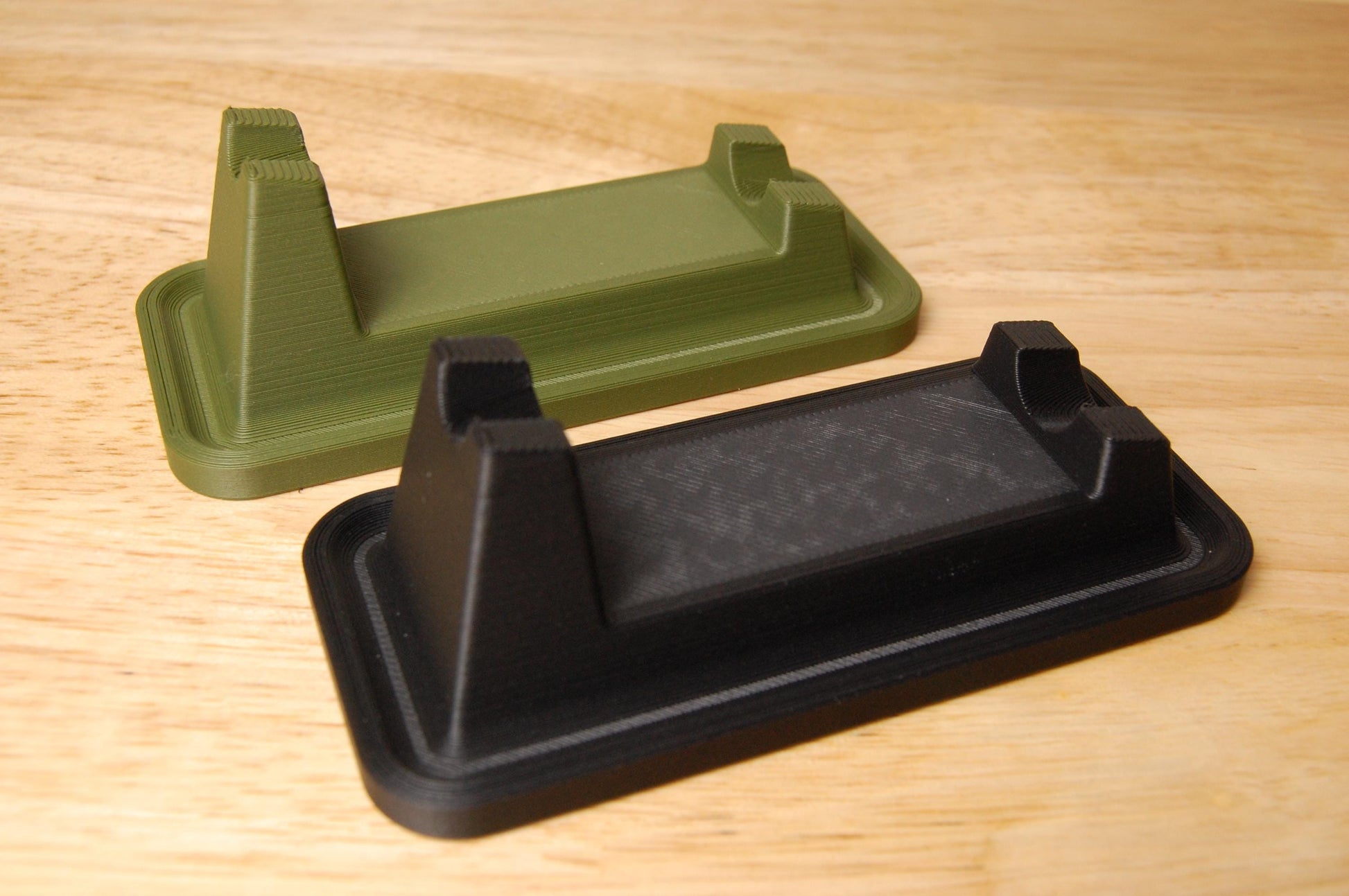 Henson Safety Razor Stands in Olive and Black, safety razor. The stand is on a wooden butcher block table.