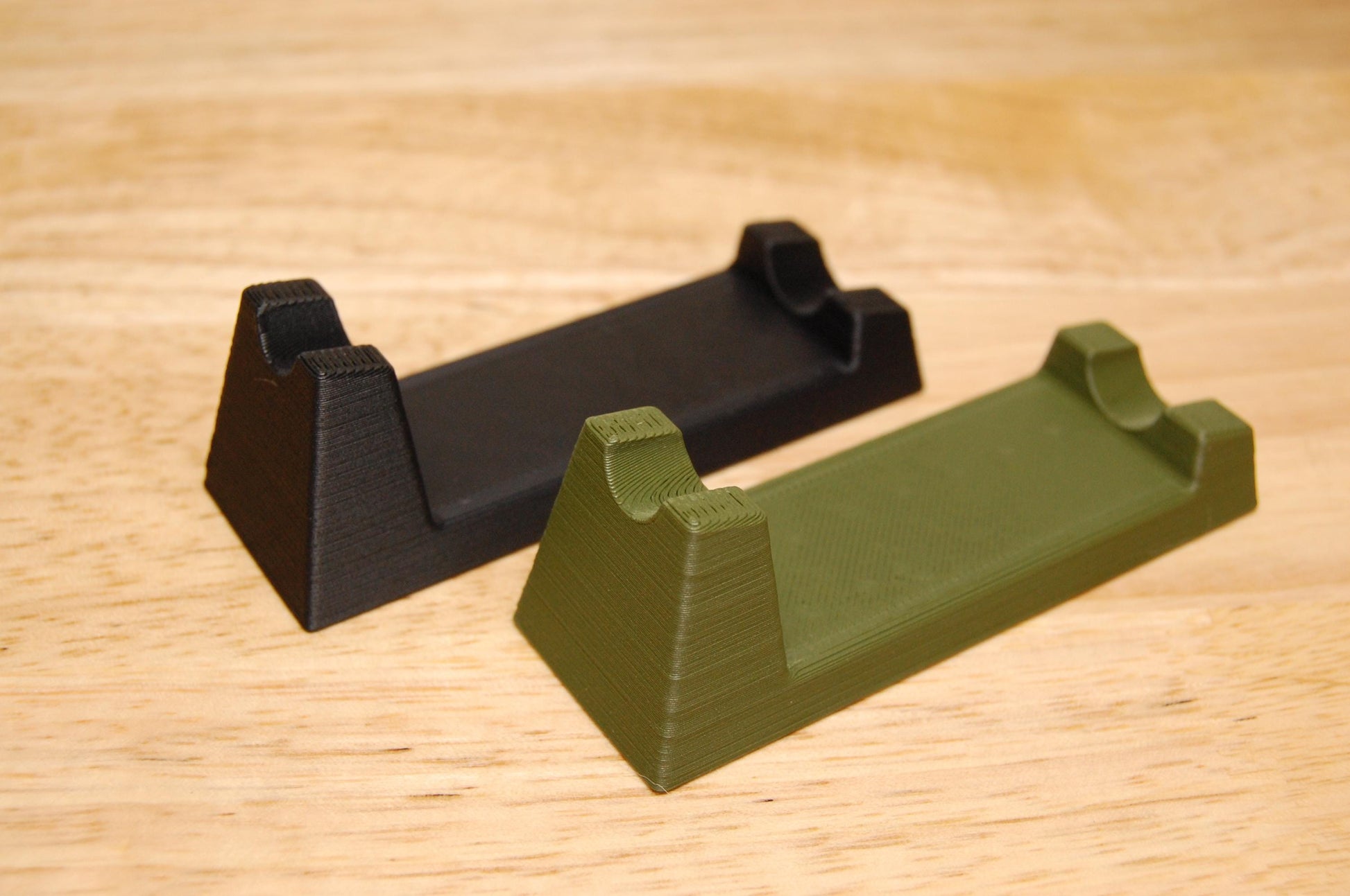 Henson Safety Razor Stands in Olive and Black, safety razor. The stand is on a wooden butcher block table.