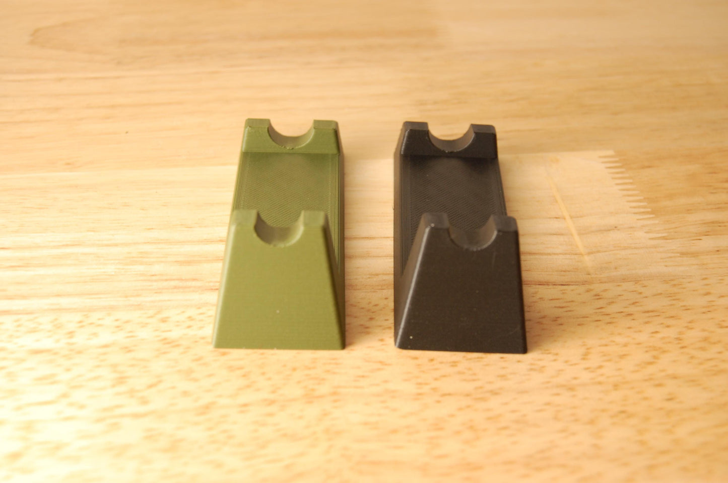 Henson Safety Razor Stands in Olive and Black, safety razor. The stand is on a wooden butcher block table.