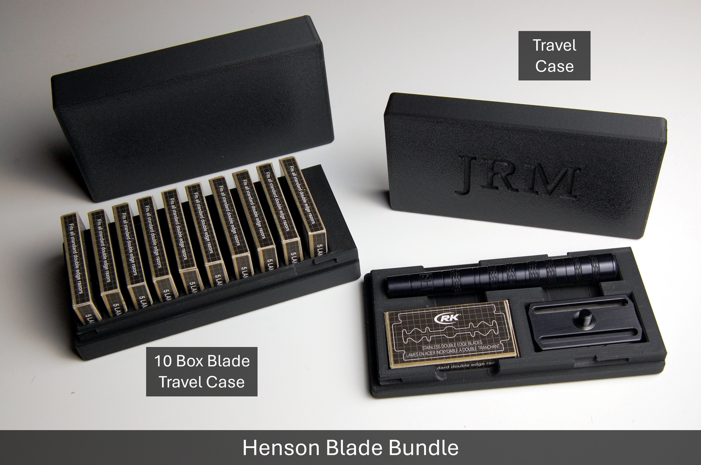 Henson Blade Bundle features a 10 box Double Edge Razor Blade Travel Case and a Henson Razor Travel Case.  Both cases are black, sitting on a solid white background.