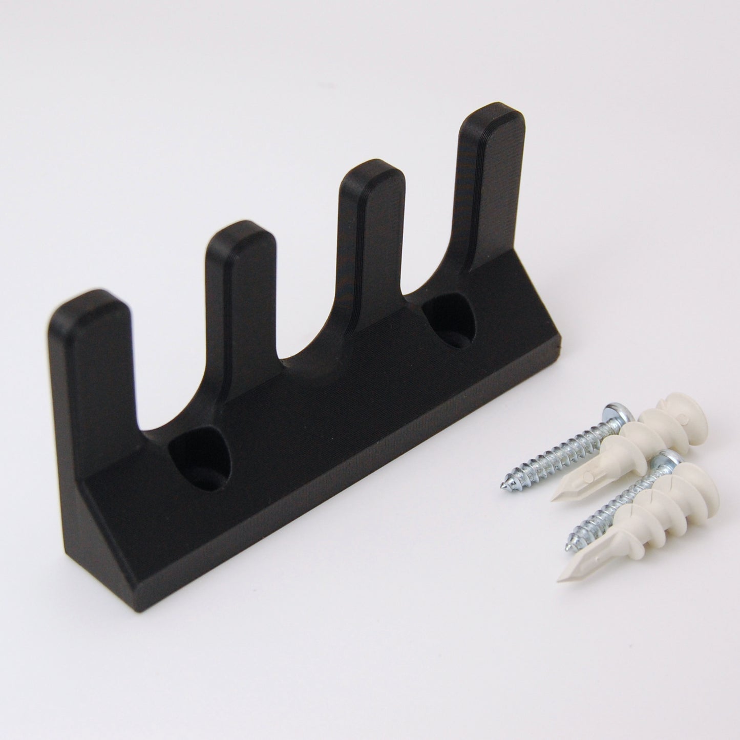 3 slot razor garden on a white background with two drywall anchors and screws.