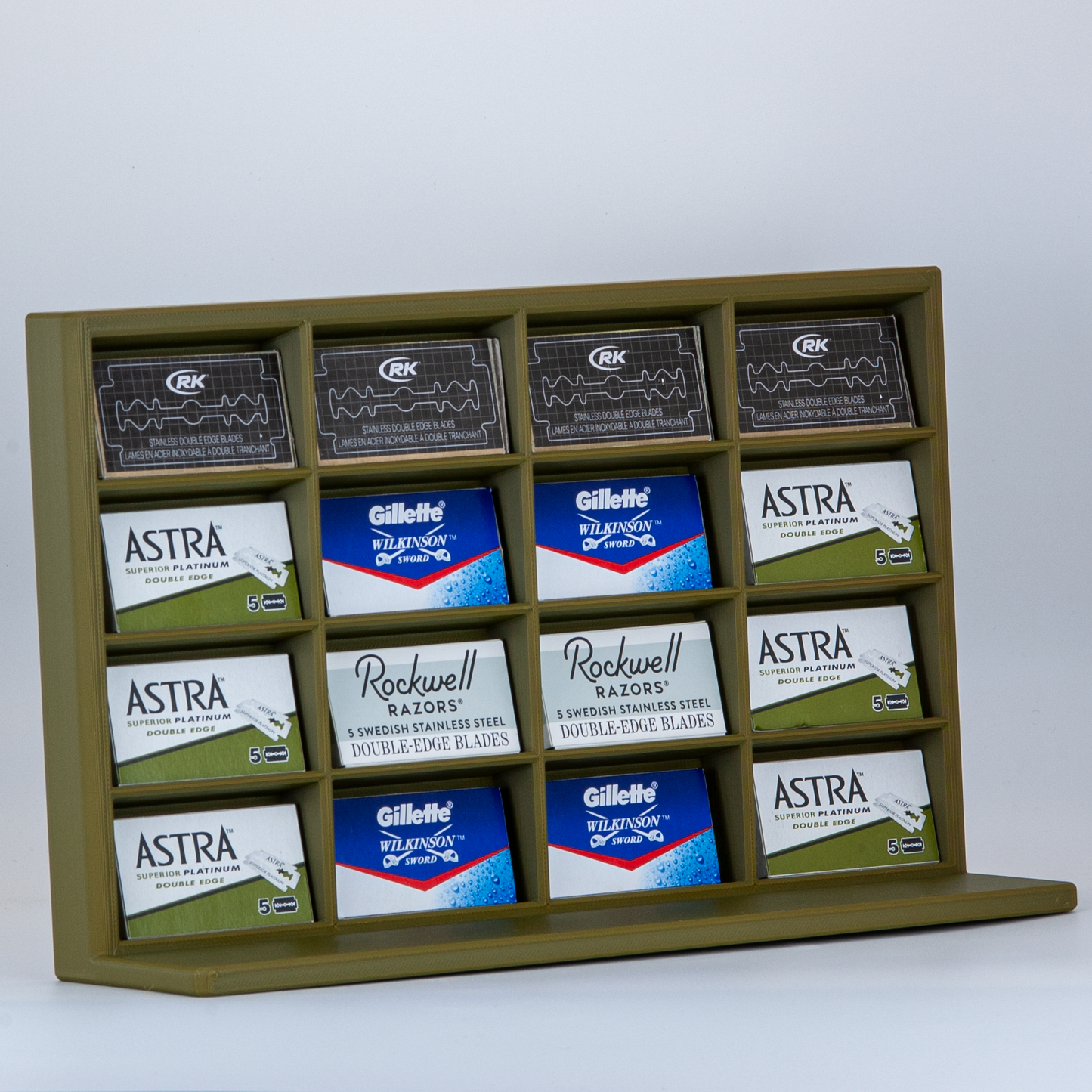 Army green razor blade stand on white background with Astra, Rockwell, RK, and Gillette Wilkinson blades displayed