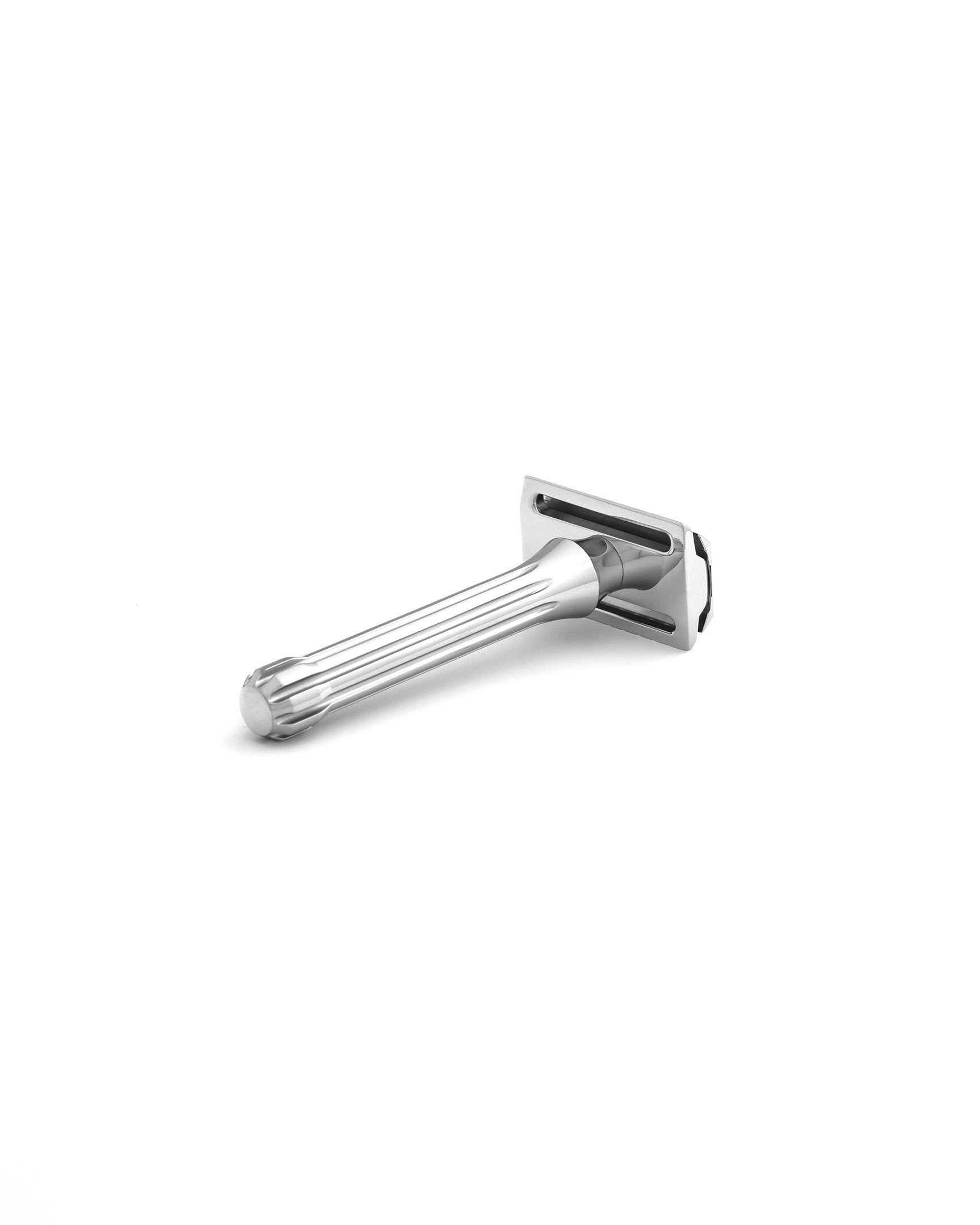 Blackbird double-edge safety razor in polished chrome finish with fluted handle, angled view on white background