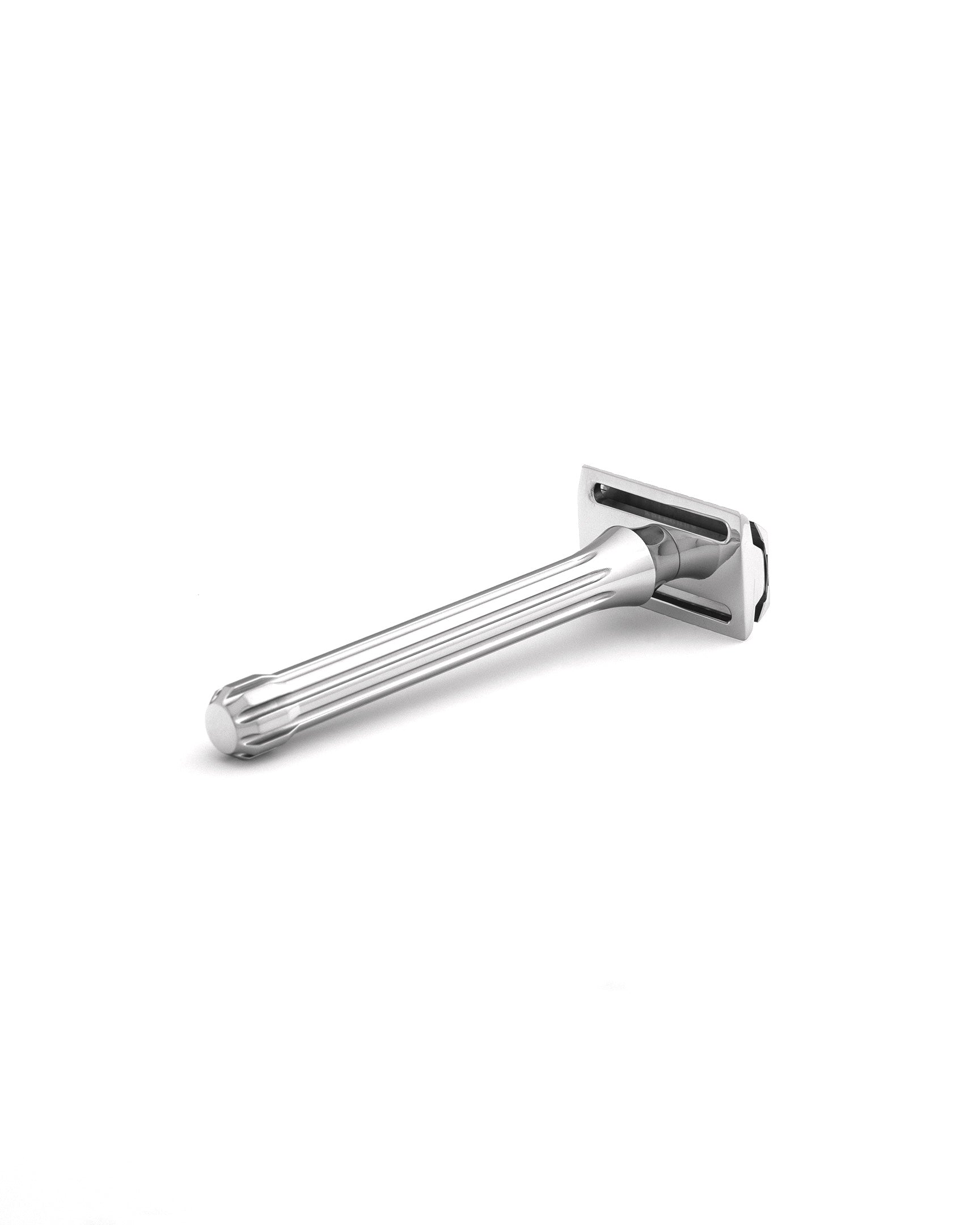 Chrome-finished Blackbird double-edge safety razor with fluted metal handle on white background