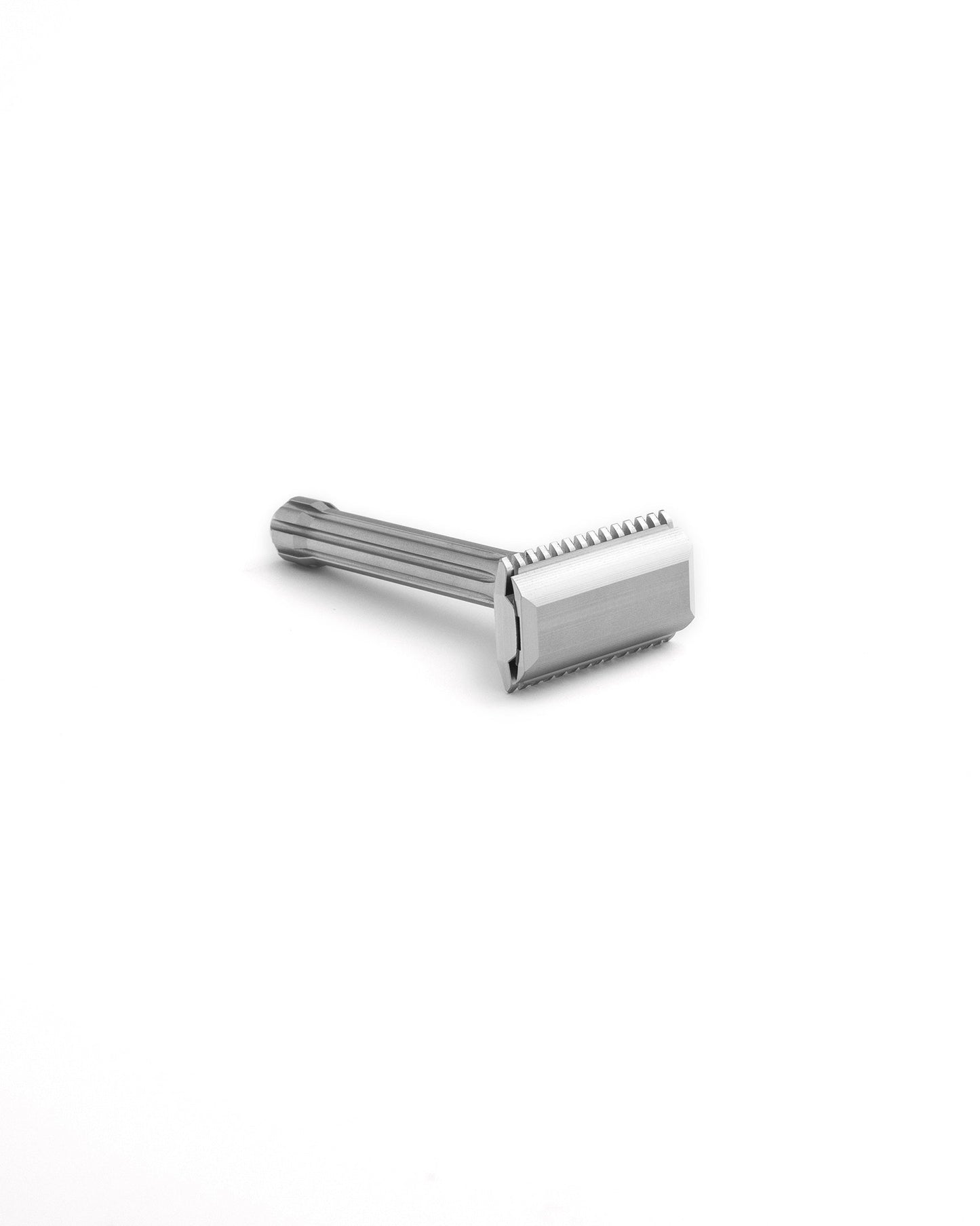 Blackbird double-edge safety razor in polished stainless steel with ridged handle, lying on white background