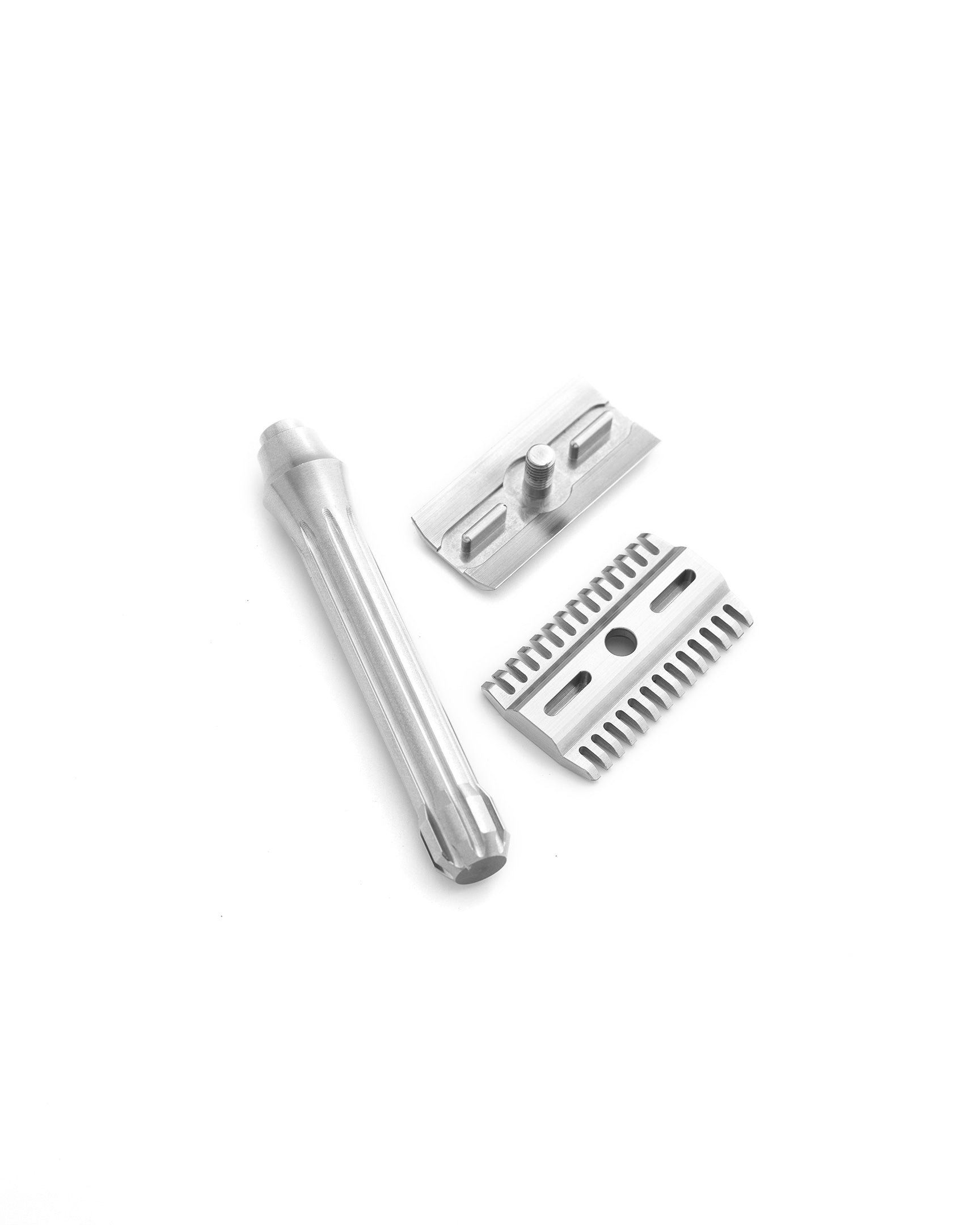 Disassembled three-piece Blackbird safety razor in brushed stainless steel showing handle, base plate with teeth, and top cap