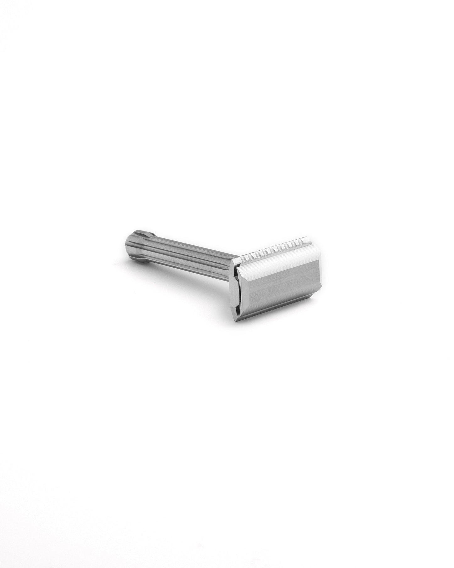Blackbird double-edge safety razor in polished stainless steel with ridged handle, viewed at an angle on white background