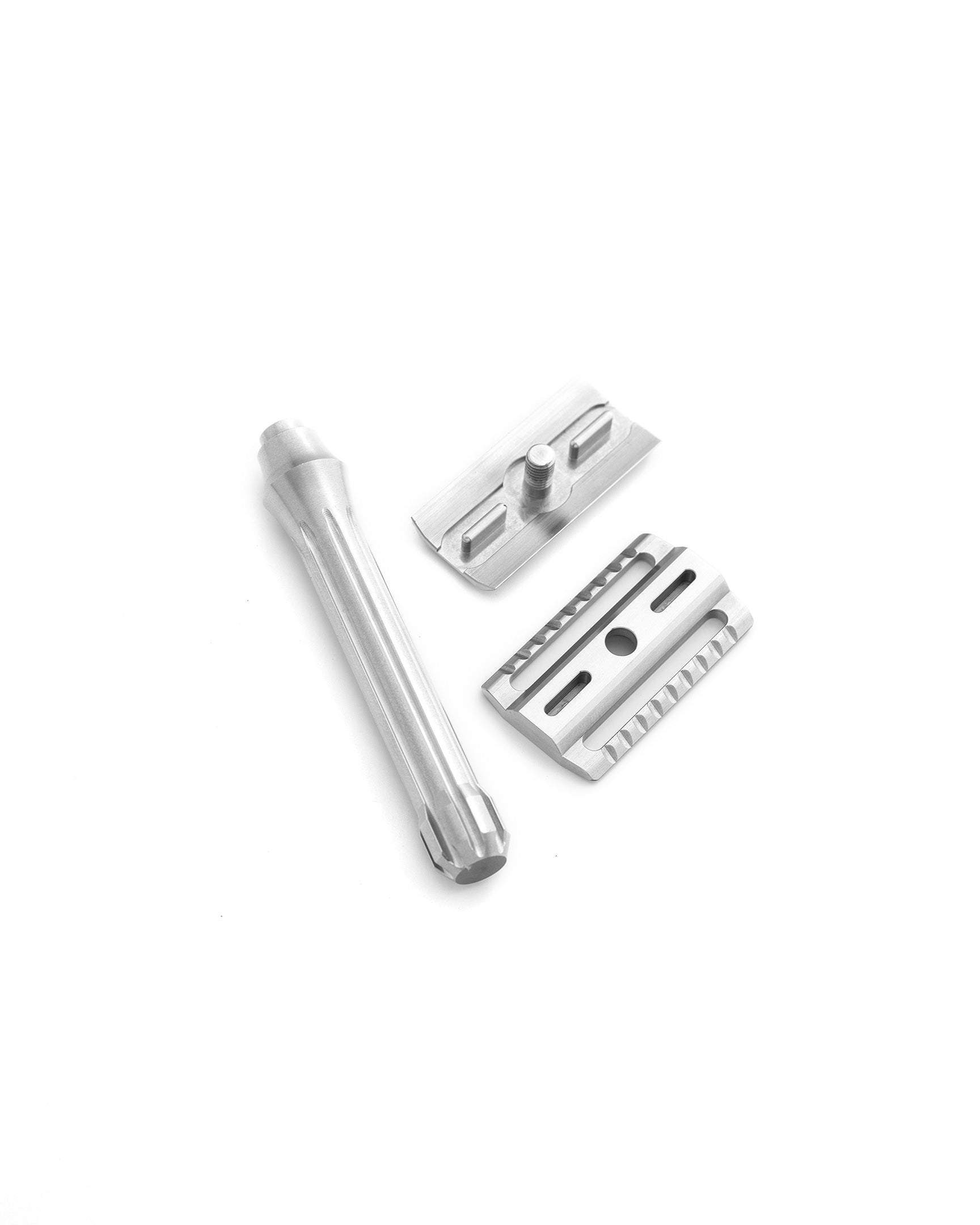 Disassembled three-piece Blackbird safety razor in matte silver finish showing handle, base plate, and top cap