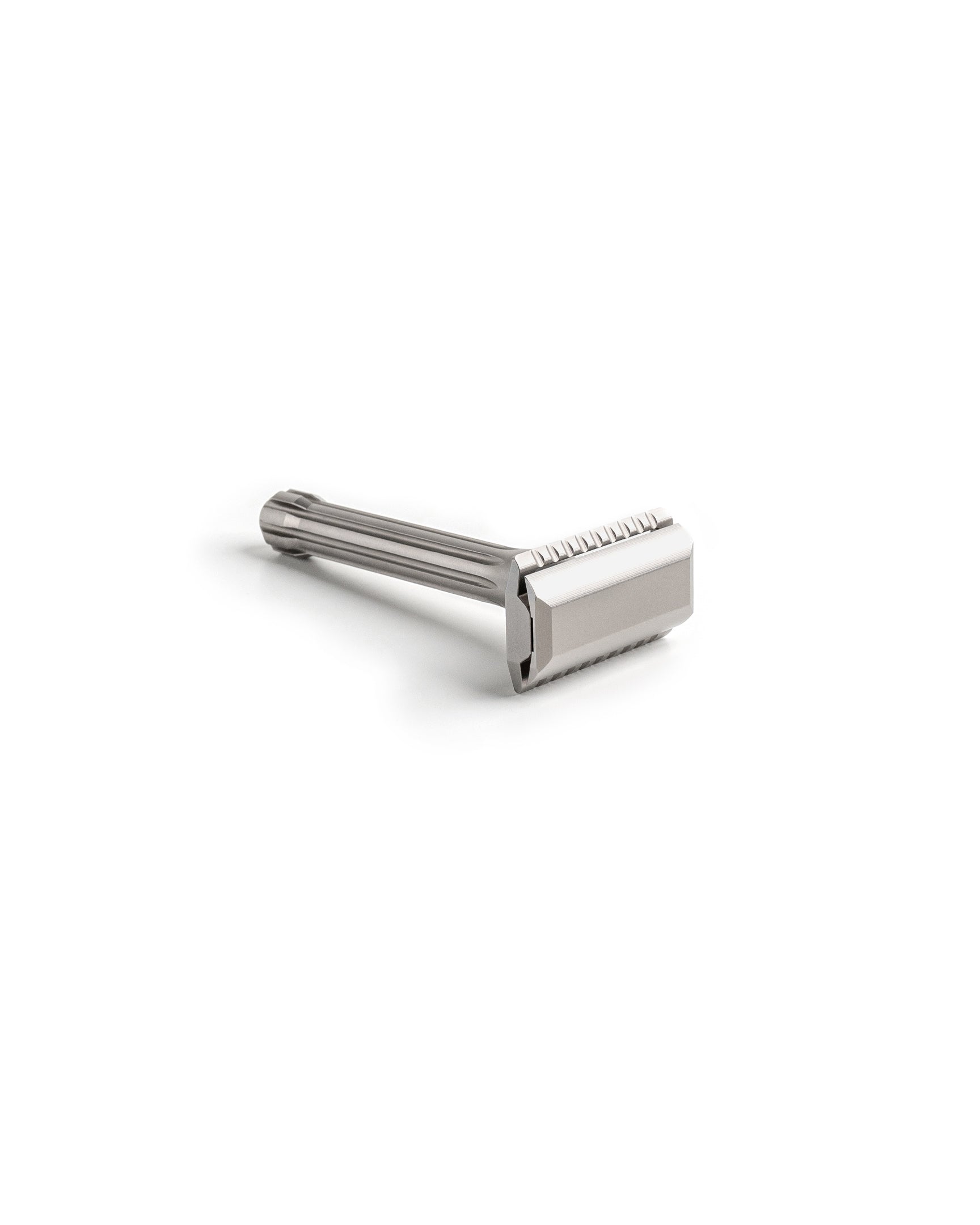 Blackbird Titanium double-edge safety razor with fluted handle and matte silver finish, laying on its side