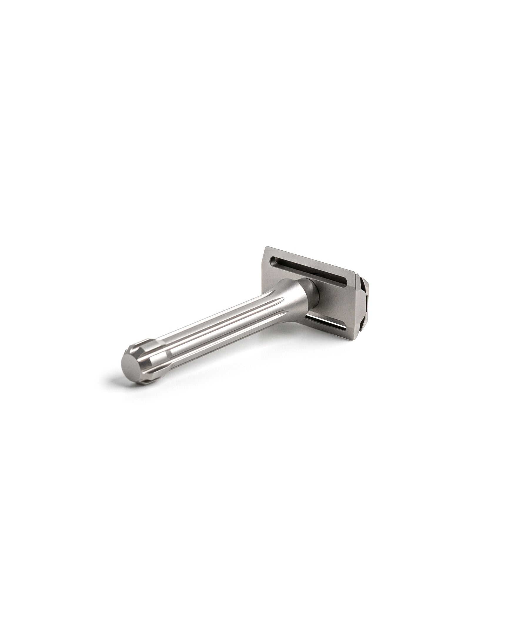 Blackbird Titanium double-edge safety razor with fluted handle and matte silver finish, angled view on white background