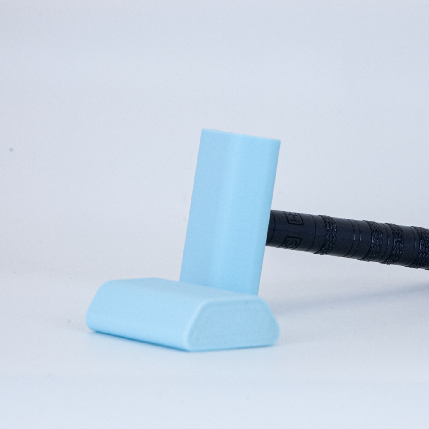 Light Blue Henson cover on a black henson razor on a white background