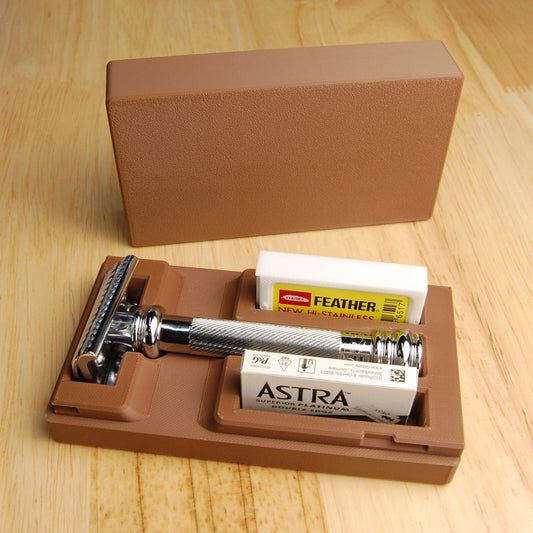 Merkur 39C Razor with Astra razor blades and Feather brand  razor blades  in a brown case on a wooden surface