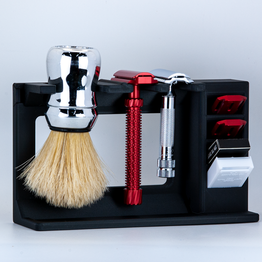 Black Mission control two razor countertop shave organizer on a white background.  A red Oliworks razor and chrome Merkur razor are hanging in the stand. 