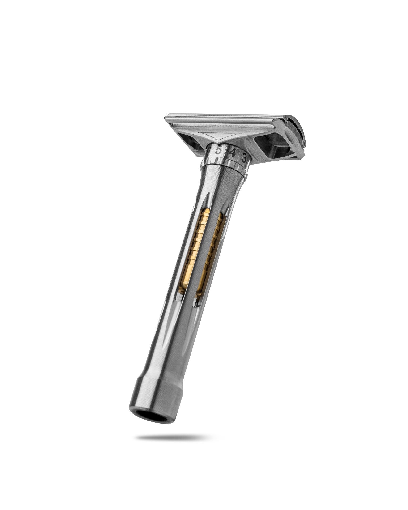 Adjustable stainless steel double-edge safety razor with numbered dial settings 3-5 and gold spring visible through handle cutout