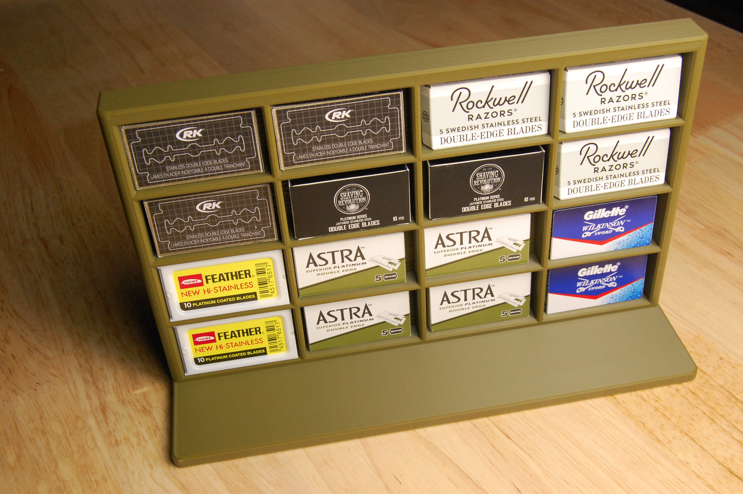 Display of various razor blade boxes on a wooden surface