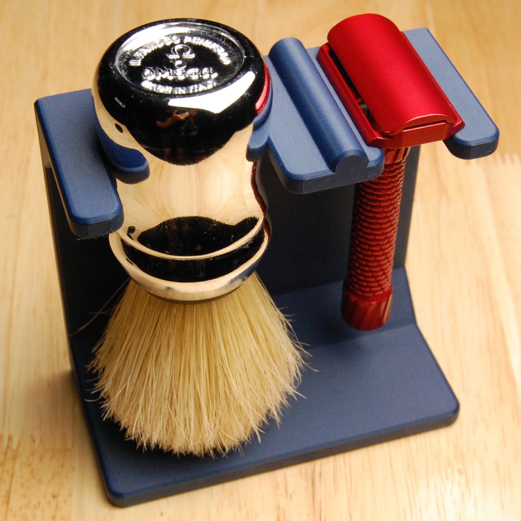 Shaving brush, razor, and stand on a wooden surface