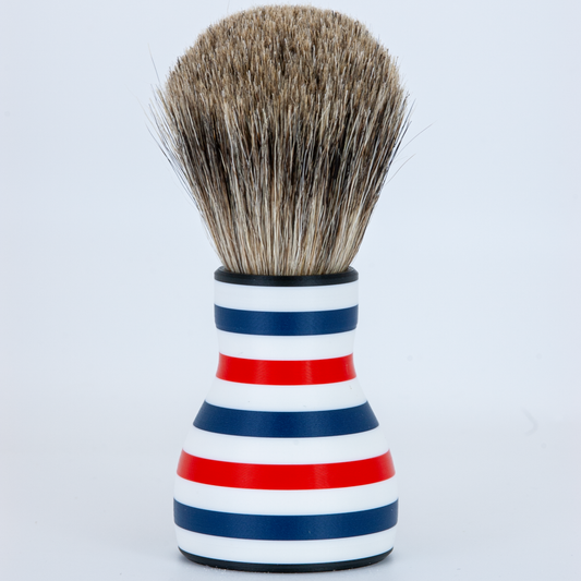 Shaving brush with a striped handle on a white background