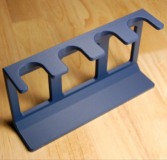 Navy blue shaving brush stand on a wooden background