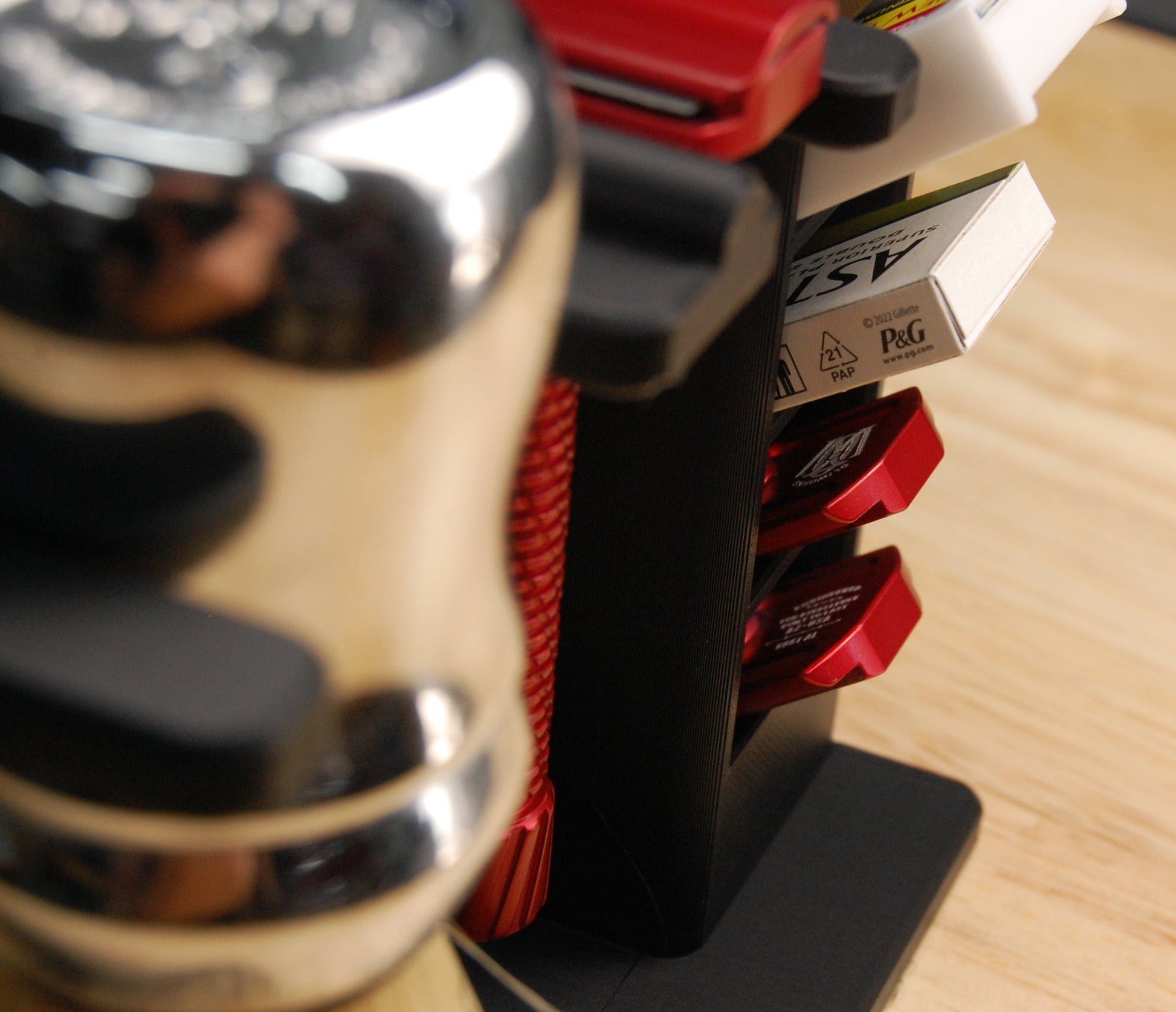 Oliworks razor in shaving organizer, closeup side view