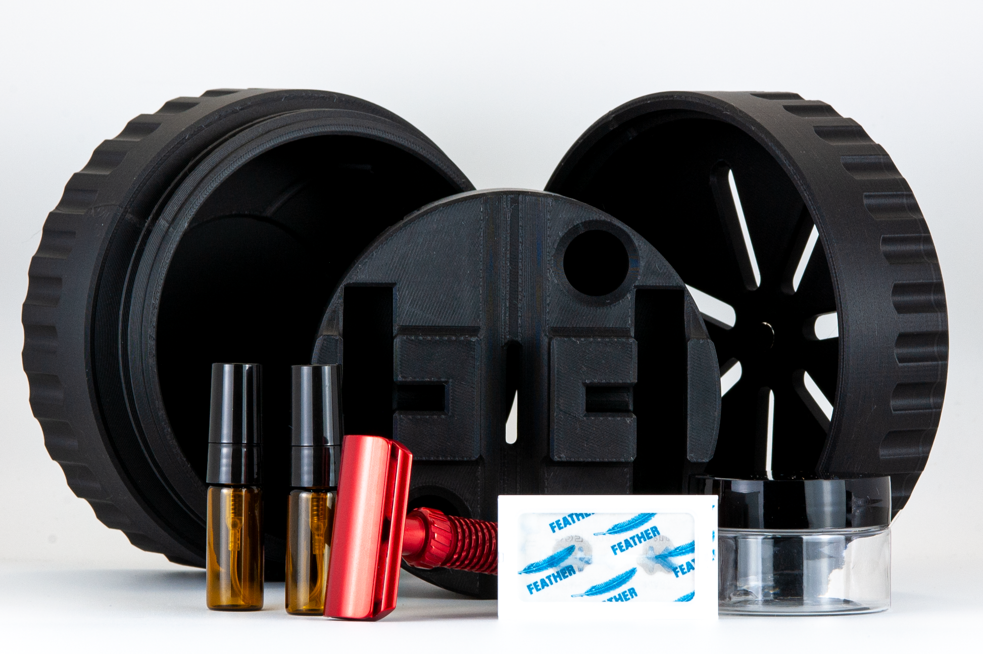 Black UFO with all pieces and items to be stored, set out on a white background