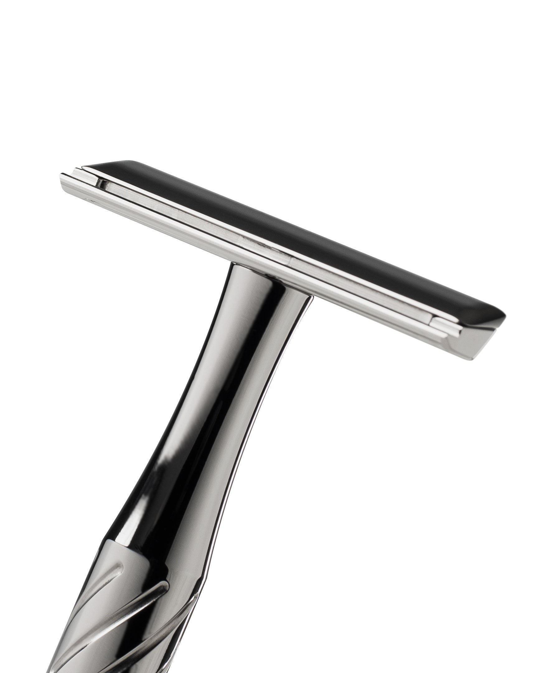 Polished silver titanium safety razor with black blade guard, close-up angled view showing T-shaped head and twisted handle