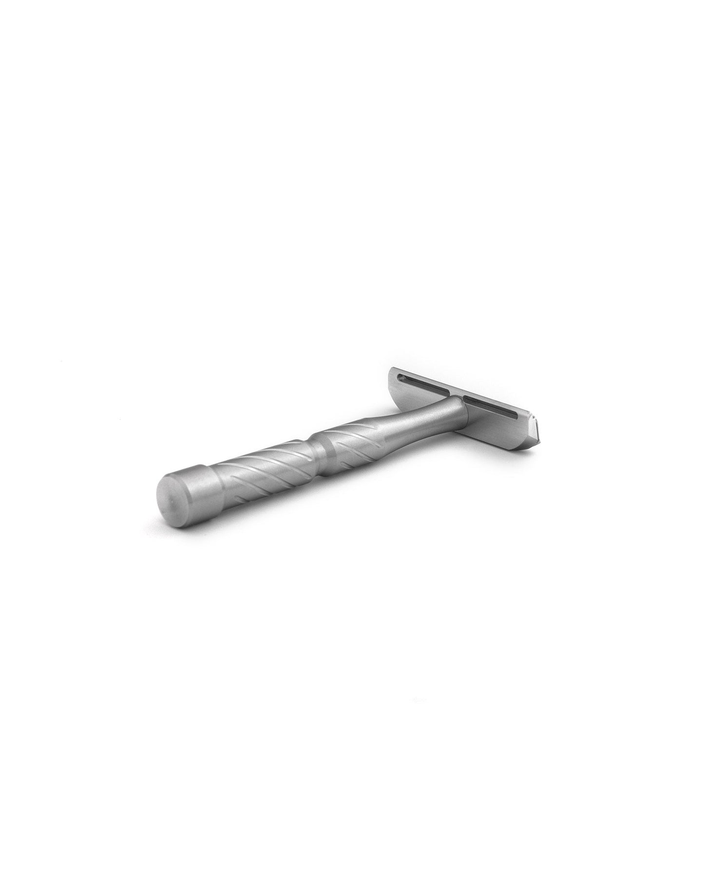 Stainless steel double-edge safety razor with spiral-textured handle, brushed metal finish, lying on white background