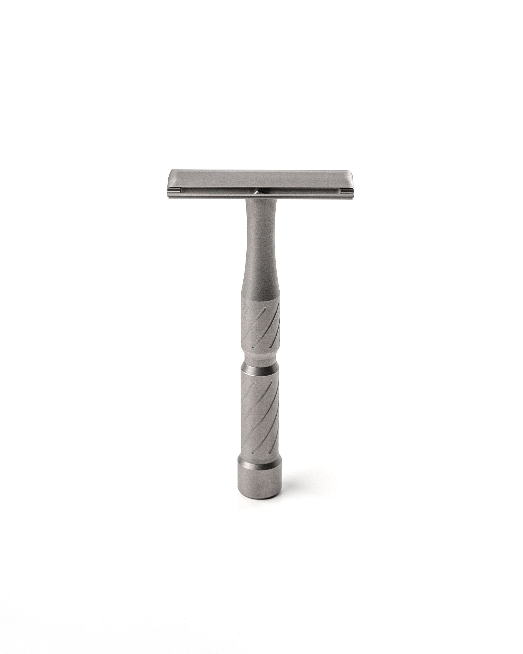 Vector Titanium double-edge safety razor with matte gray titanium finish and diagonal-grooved handle