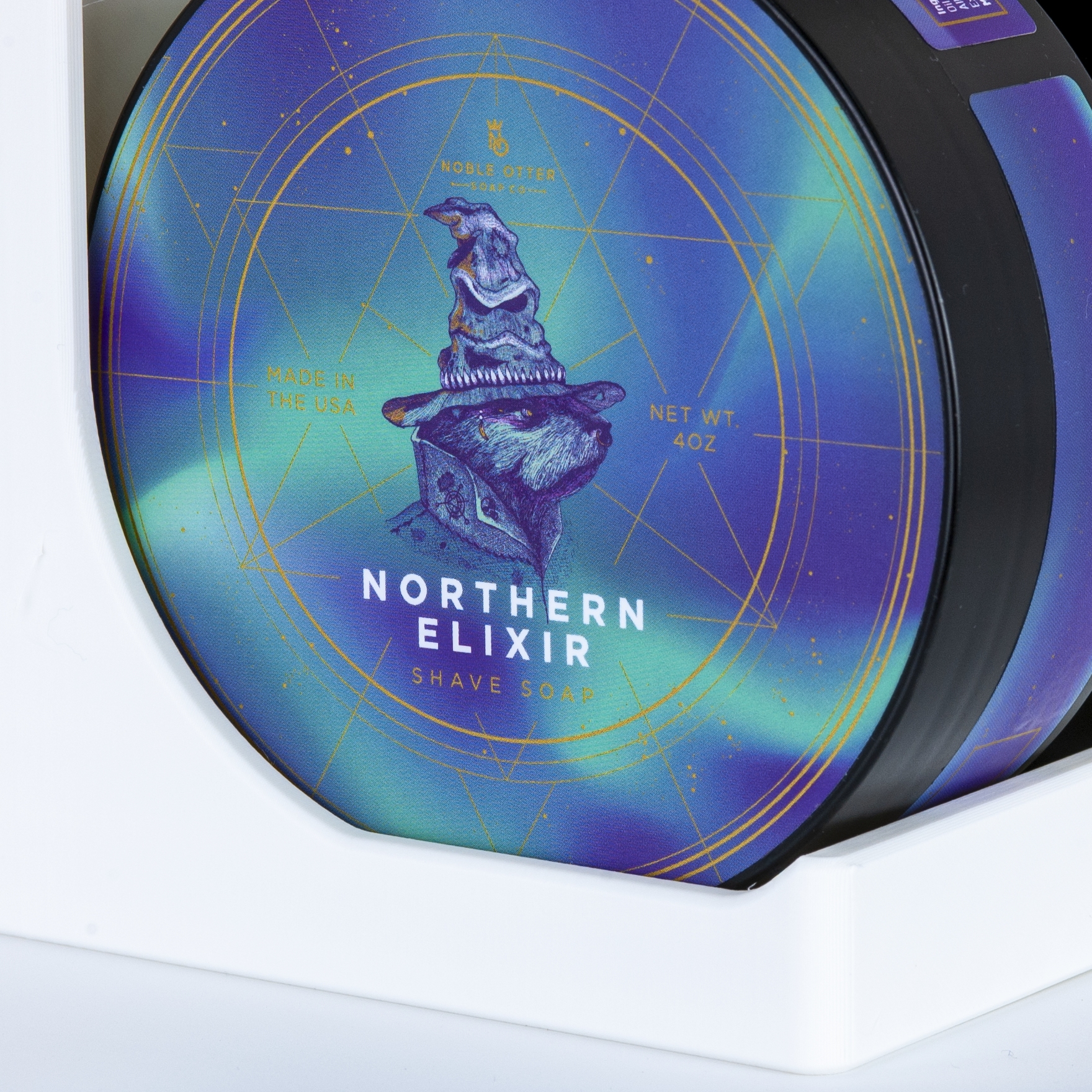 Northern Elixir shave soap packaging with a blue and purple gradient label.