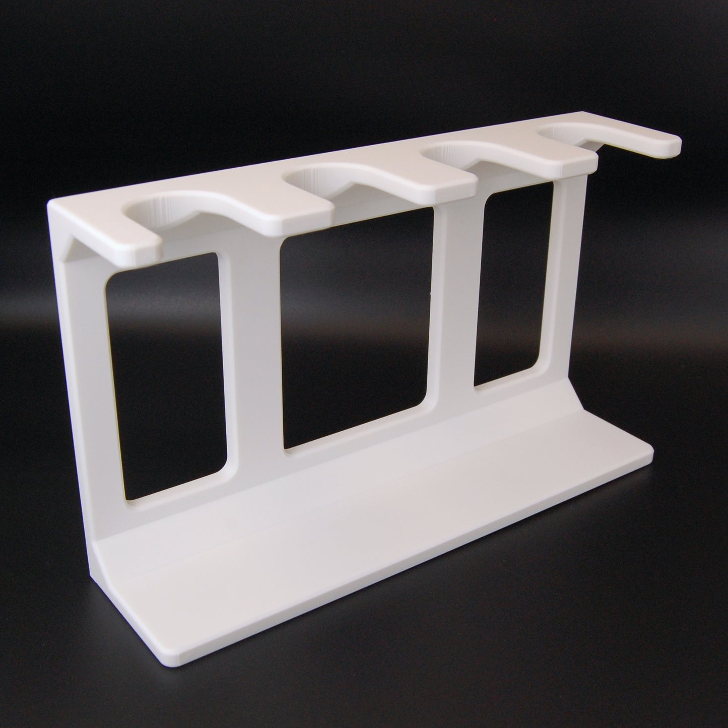 White Shaving Brush stand on a black background.