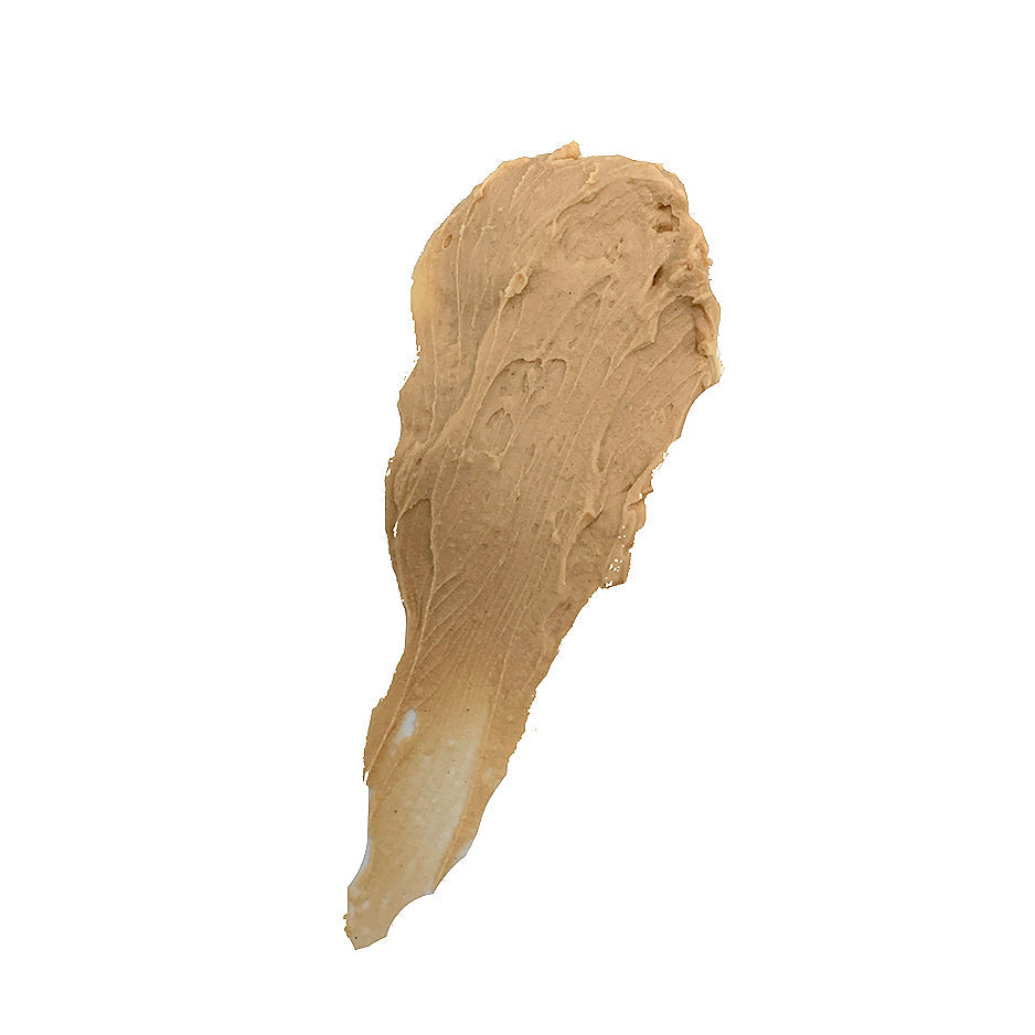 Thick smear of Formula 49 shaving cream in a warm beige tone spread in a tapered teardrop shape on white background