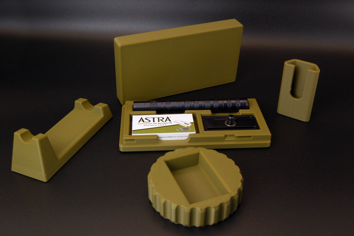 Henson razor bundle in army green on black background.  Includes Henson Case, Henson Cover, razor stand, razor refueler.