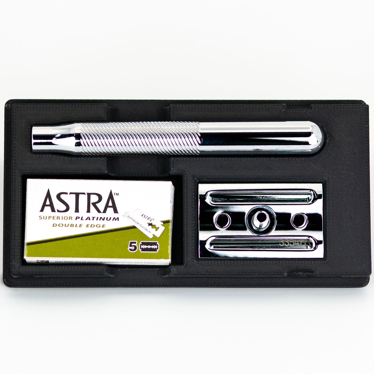 Open King C. Gillette safety razor travel case with chrome razor handle, box of Astra Superior Platinum blades, and chrome baseplate