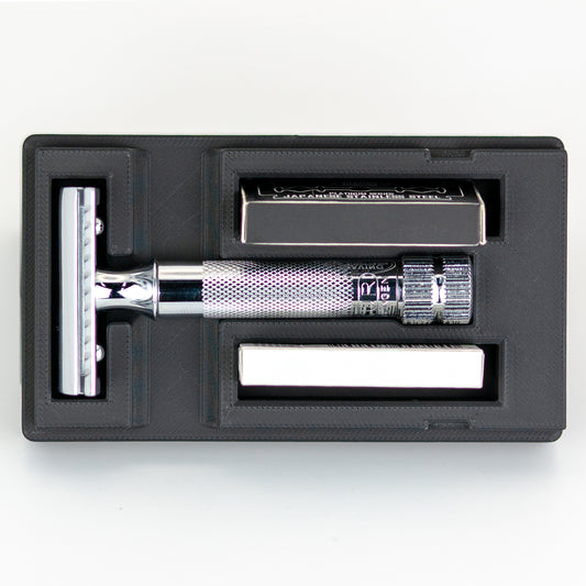 Open Merkur 34C safety razor travel case with chrome butterfly-style razor handle, box of Astra blades, and chrome baseplate