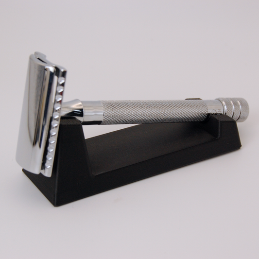 Universal razor stand in black on a white background.  Pictured with a Merkur 23C razor.
