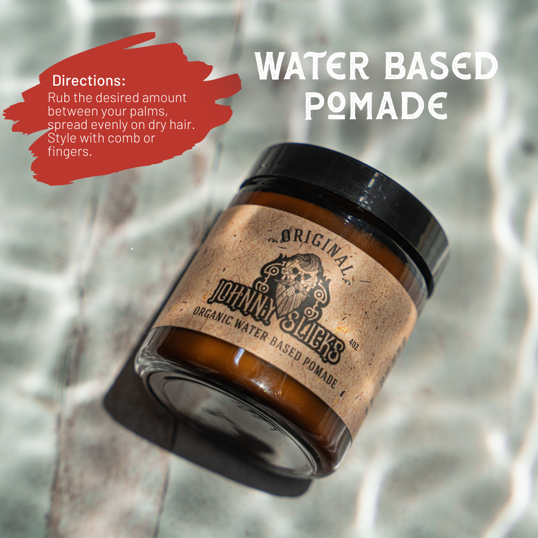 Johnny Slicks Original Organic Water Based Pomade in 4oz amber glass jar with black lid, shown on wet surface